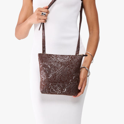 Sepia | Model wearing small rectangular crossbody purse with top zipper and interior pocket
