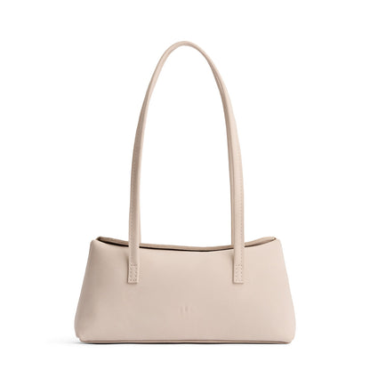 Dragon Bone | Leather bowler bag with magnetic closure against a white background