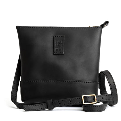 Black | Small rectangular crossbody purse with top zipper and interior pocket