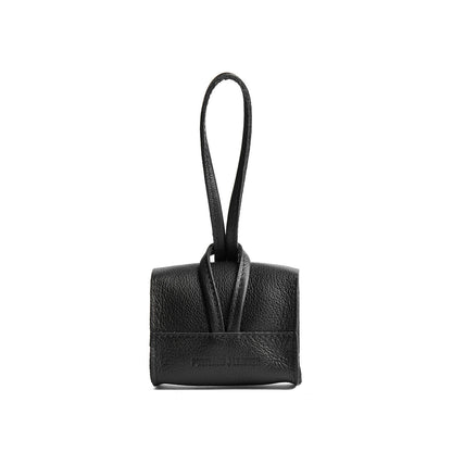 Pebbled--black | Wristlet pouch with loop strap and a flower design