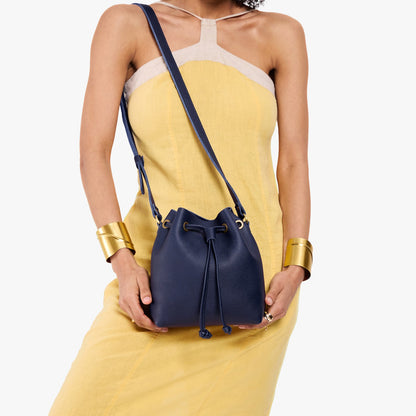 Cobalt*Small | Model wearing slouchy crossbody bag with drawstring closure