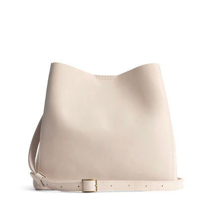Dragon Bone | symmetrical bucket bag with latch closure and removable crossbody strap
