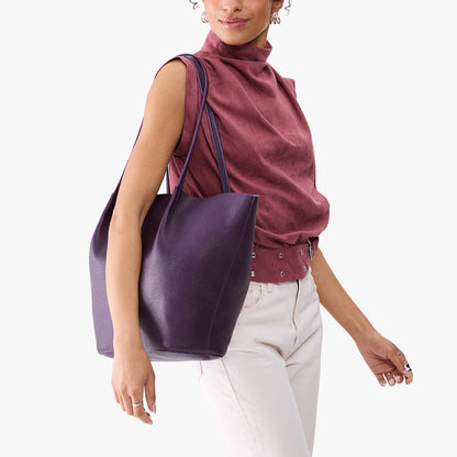 Empire*Oversized | Model carrying extra wide bucket shaped tote bag with matching leather handles