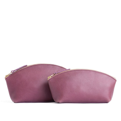 Kyoto | Size comparison shot of two spacious leather makeup bags with curved seams and top zipper