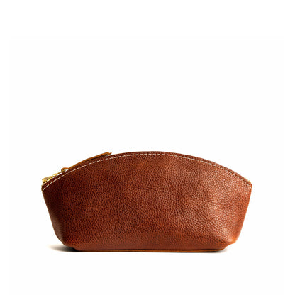 Nutmeg*Eclipse | Spacious leather makeup bag with curved seams and top zipper