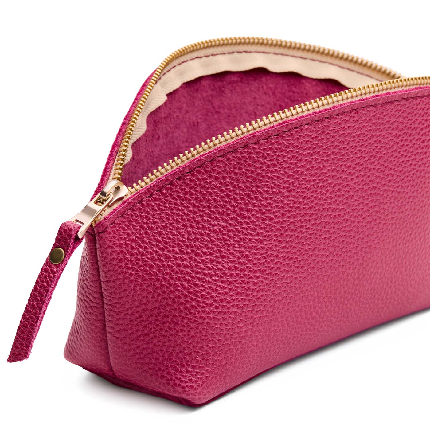 Wild Rose | Close-up of spacious leather makeup bag with curved seams and top zipper
