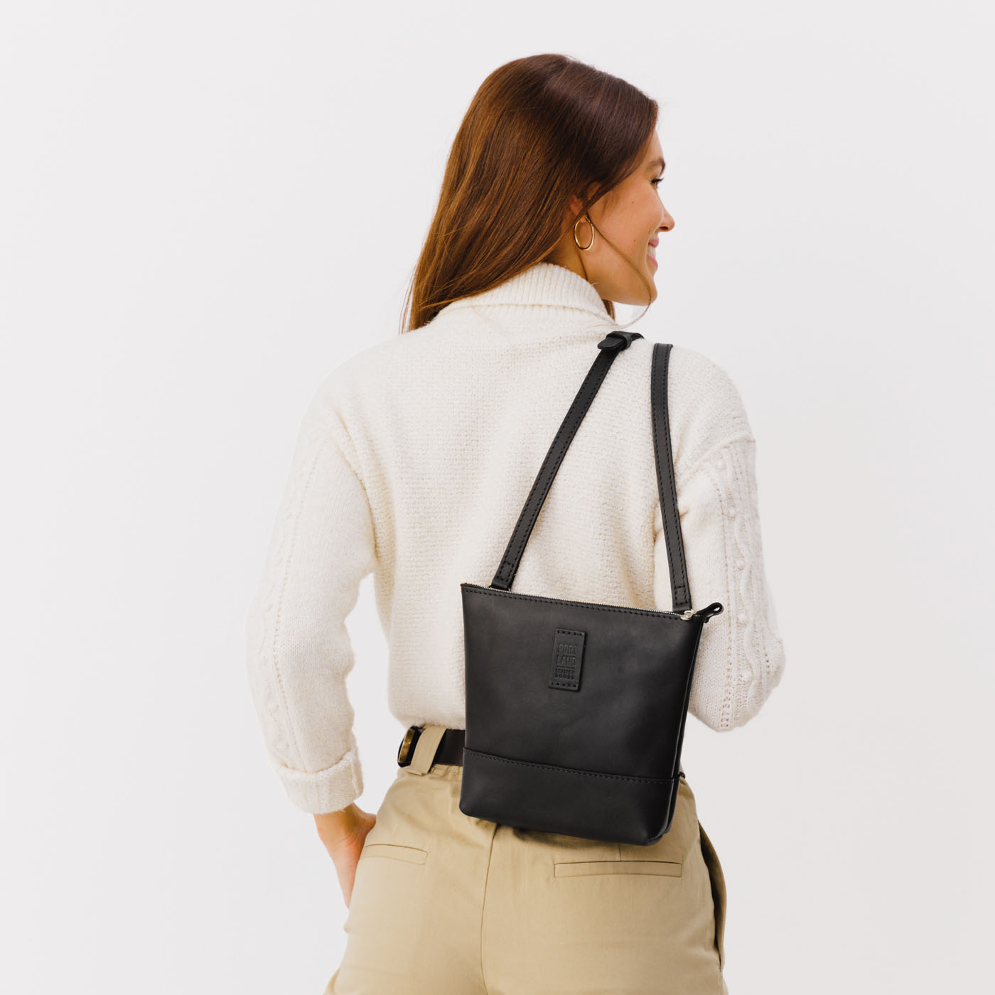 Black | Small rectangular crossbody purse with top zipper and interior pocket