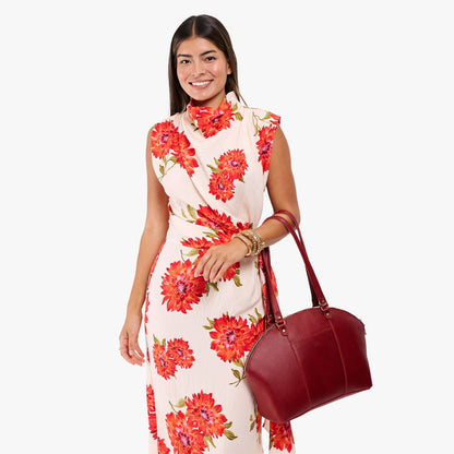 Chili Red*Large | Model holding a half circle crossbody bag with handles and removable crossbody strap