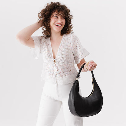 Pebbled--black*Large | Large crescent shaped shoulder bag with zipper closure and adjustable strap
