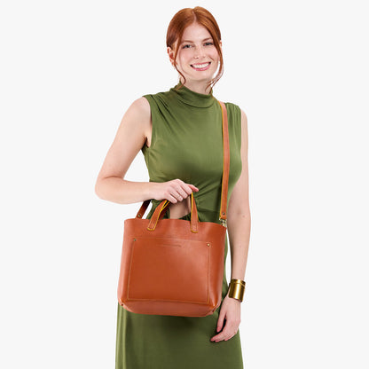 Sienna*Classic | Model holding midsize crossbody tote with handles and a pocket