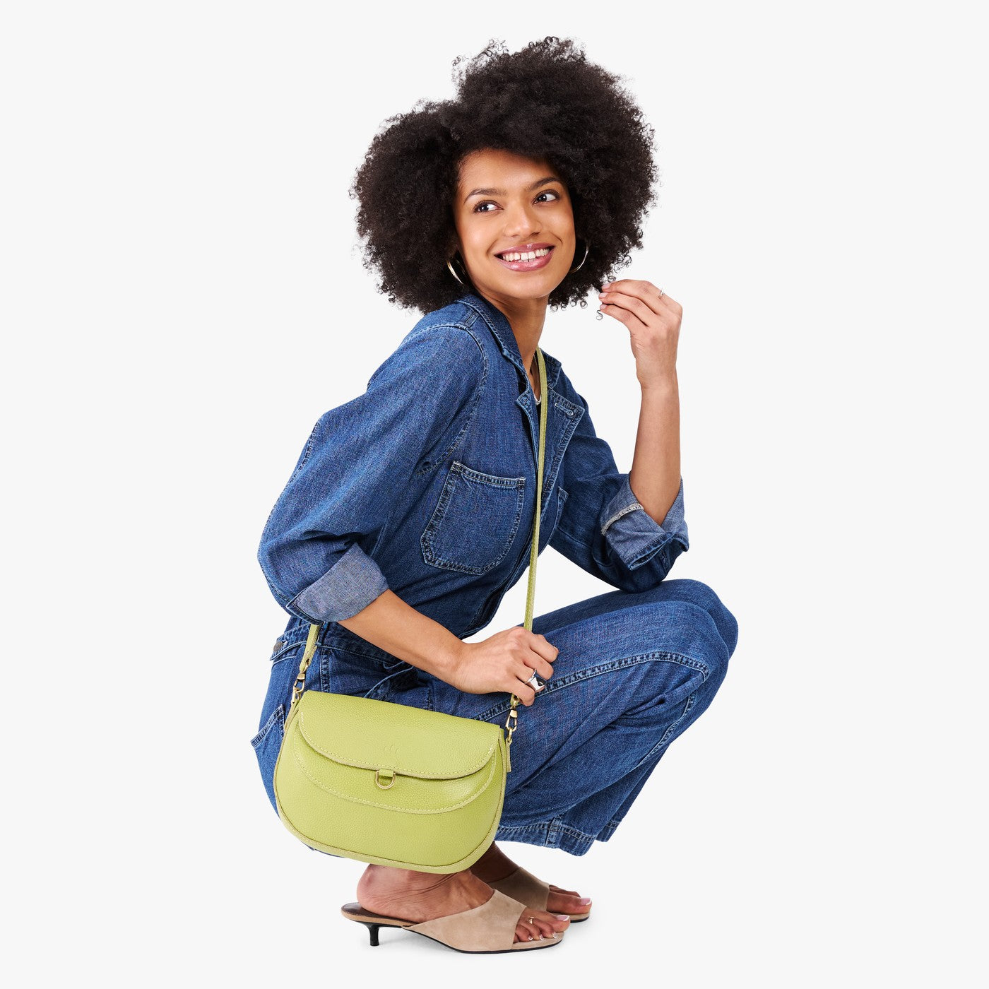 Wasabi*Large | Model wearing a petite leather Crossbody with a flap and magnetic closure