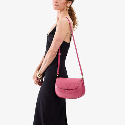 Wild Rose*Large | Model wearing a leather Crossbody with a flap and magnetic closure