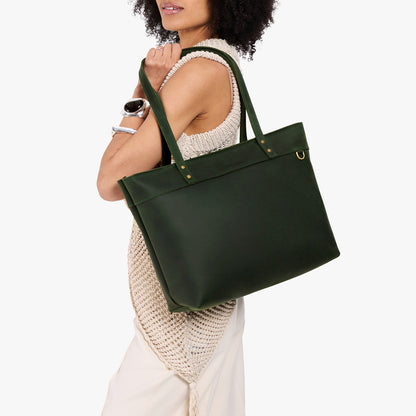 Evergreen*Large*Zipper | Model wearing leather tote bag with riveted straps and exterior key loop