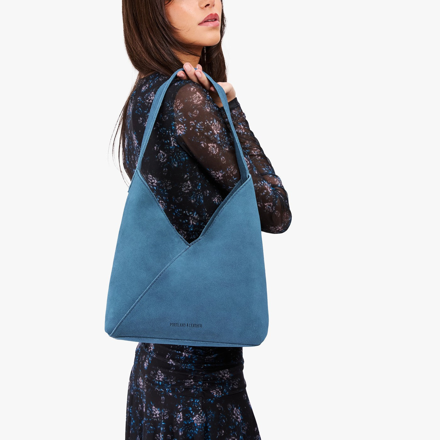 Mariner Blue*Large | Model wearing mid-size shoulder bag with magnetic snap closure