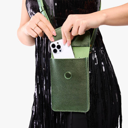 Metallic Greench | Model wearing slim, phone-shaped crossbody purse with magnetic closure