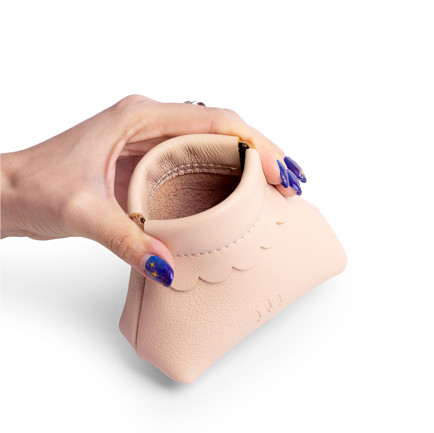 Moonflower | Hand holding leather coin pouch with scalloped edge and three Portland leather tree emblems open