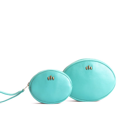 Optical | Small and large oval shaped pouches with zipper and wristlet strap