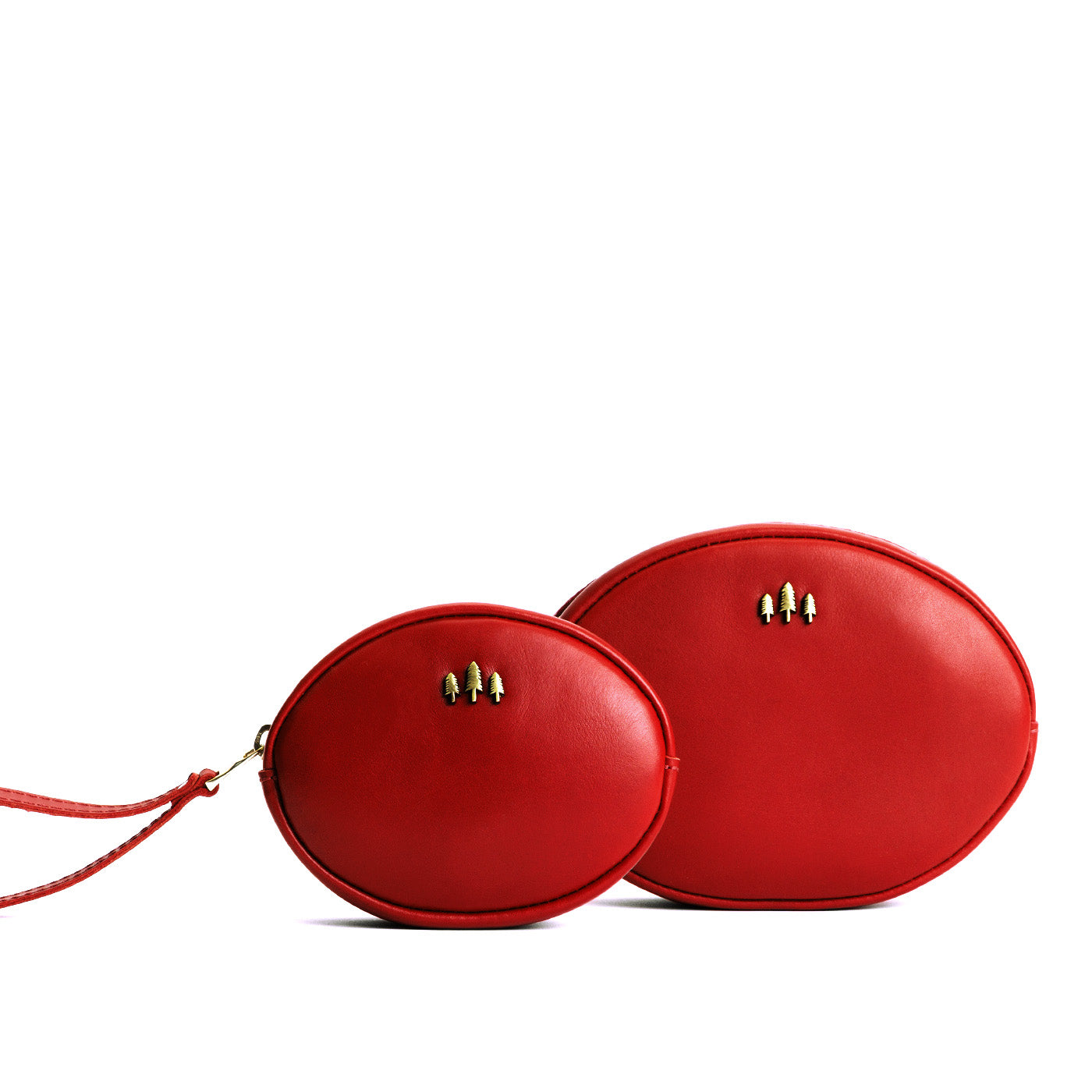 Ruby | Small and large oval shaped pouches with zipper and wristlet strap