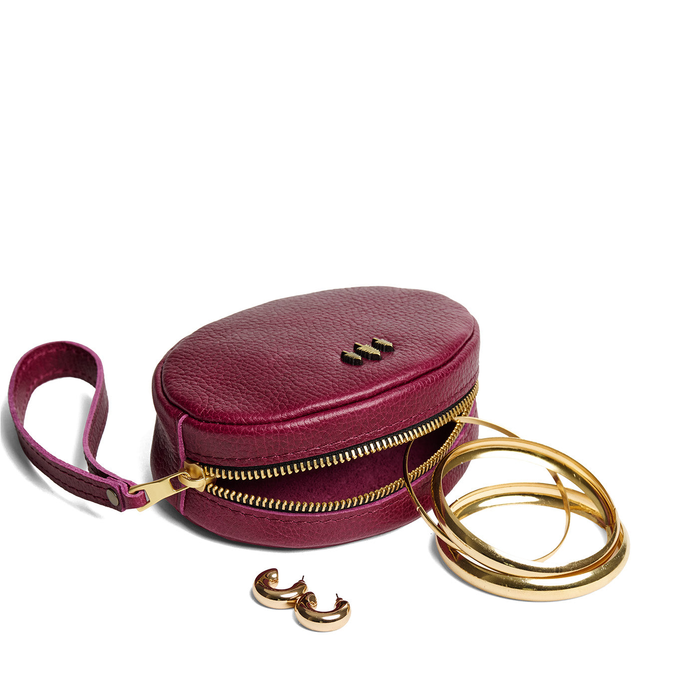 Orchid*Small | Oval shaped pouches with zipper and wristlet strap open with accessories