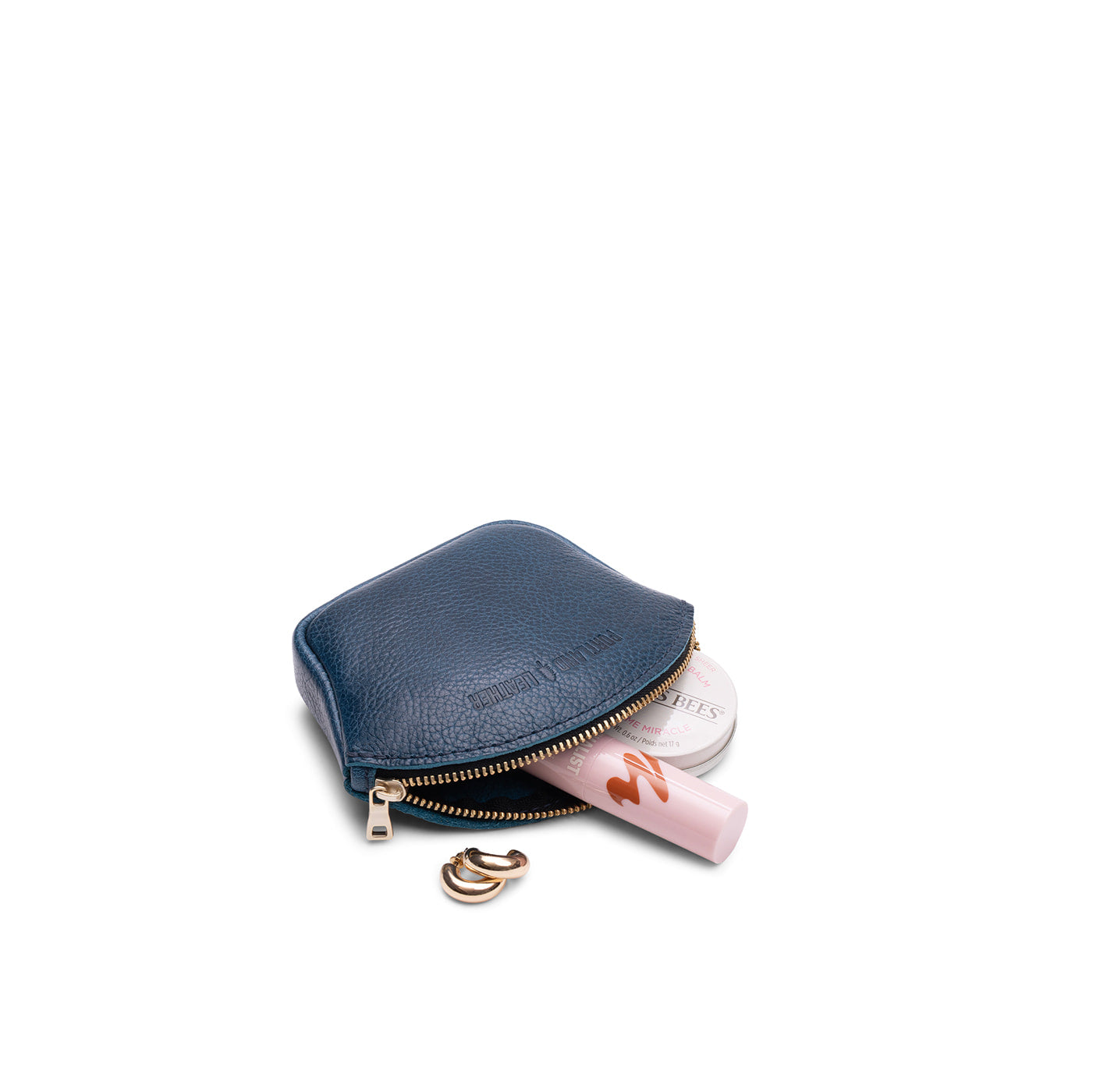 Caspian*Small | Seashell shaped leather makeup bag with curved top zipper and flat bottom
