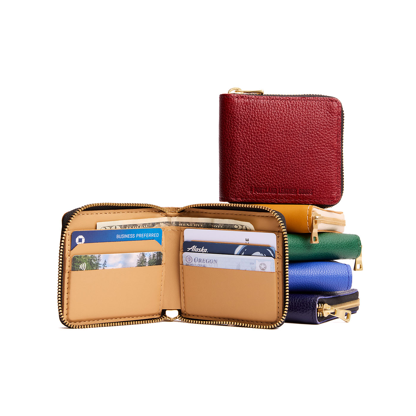 All Variants | Ten small leather zippered bifold wallets on a white background