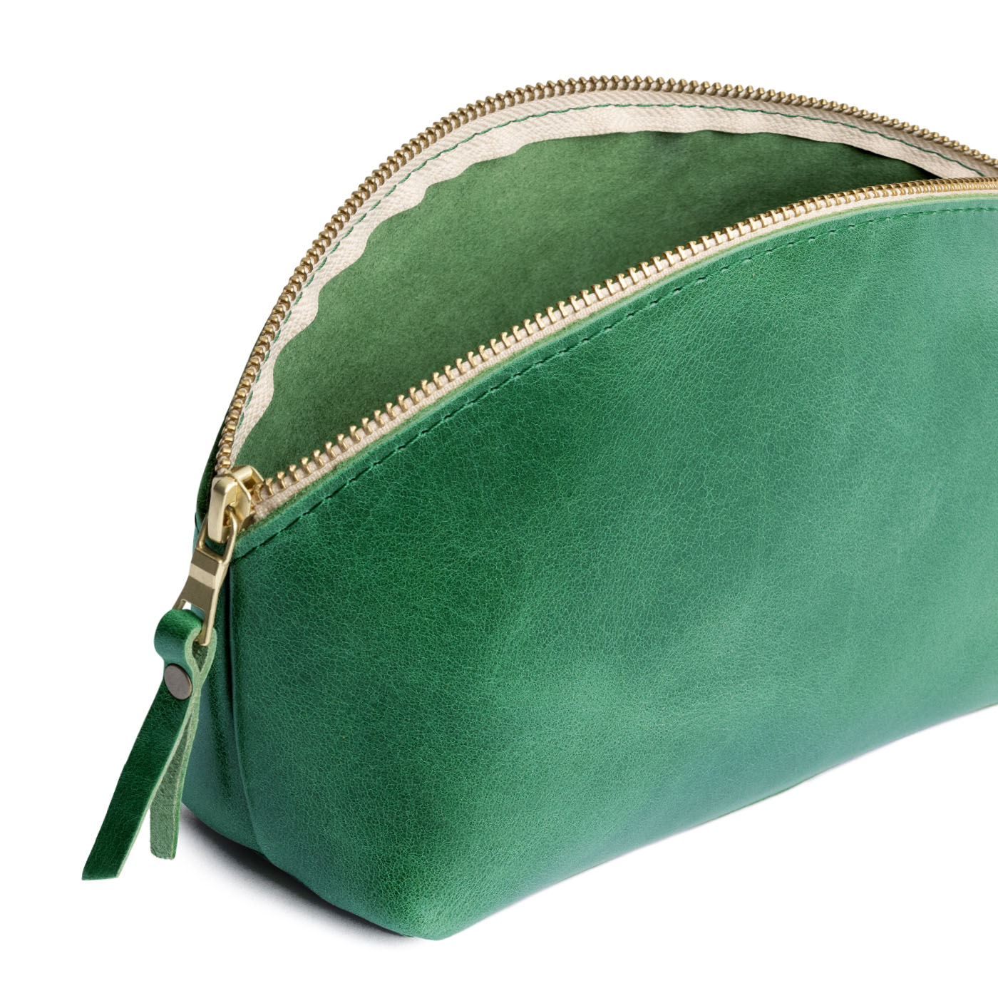 Cowboy Mint | Spacious leather makeup bag with curved seams and top zipper open