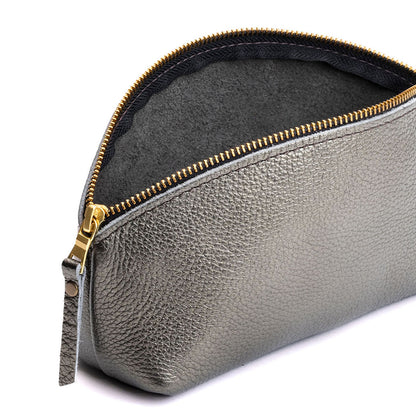 Stardust | Spacious leather makeup bag with curved seams and top zipper open
